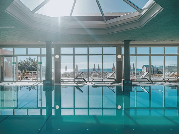 Indoor pool, pool umbrellas, sun loungers