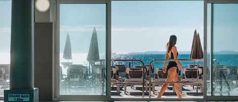Indoor pool, open 8:30 AM to 7:00 PM, pool umbrellas, sun loungers