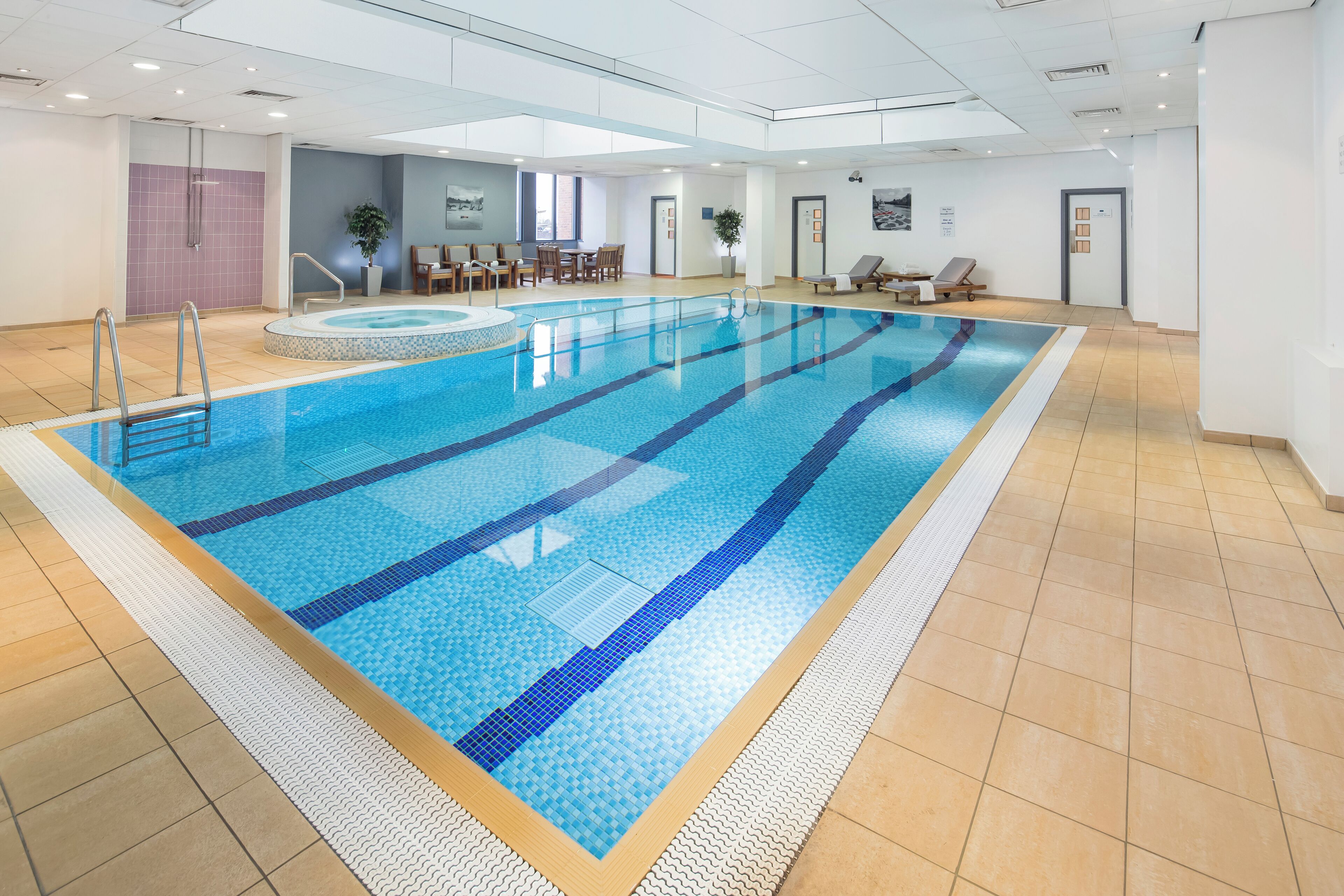 Indoor pool, open 7:30 AM to 8:00 PM, pool loungers