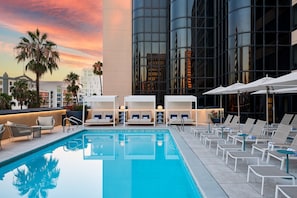 Outdoor pool, open 7:00 AM to 10:00 PM, cabanas (surcharge)