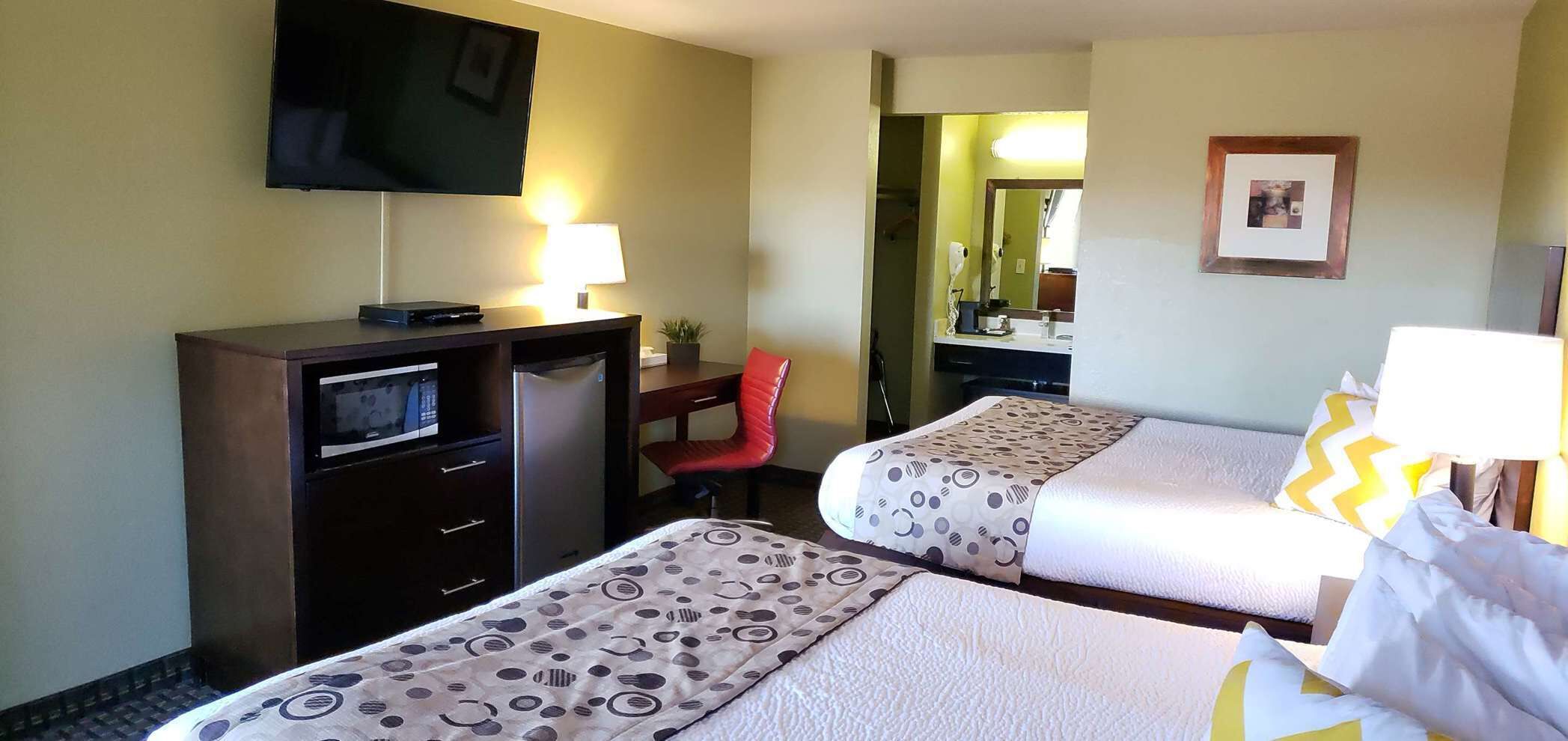 Premium bedding, desk, laptop workspace, blackout curtains