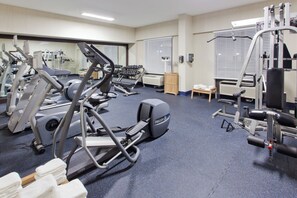 A gym with various exercise equipment, including treadmills, dumbbells, and weight machines. - Holiday Inn Shreveport Downtown by IHG (Shreveport)