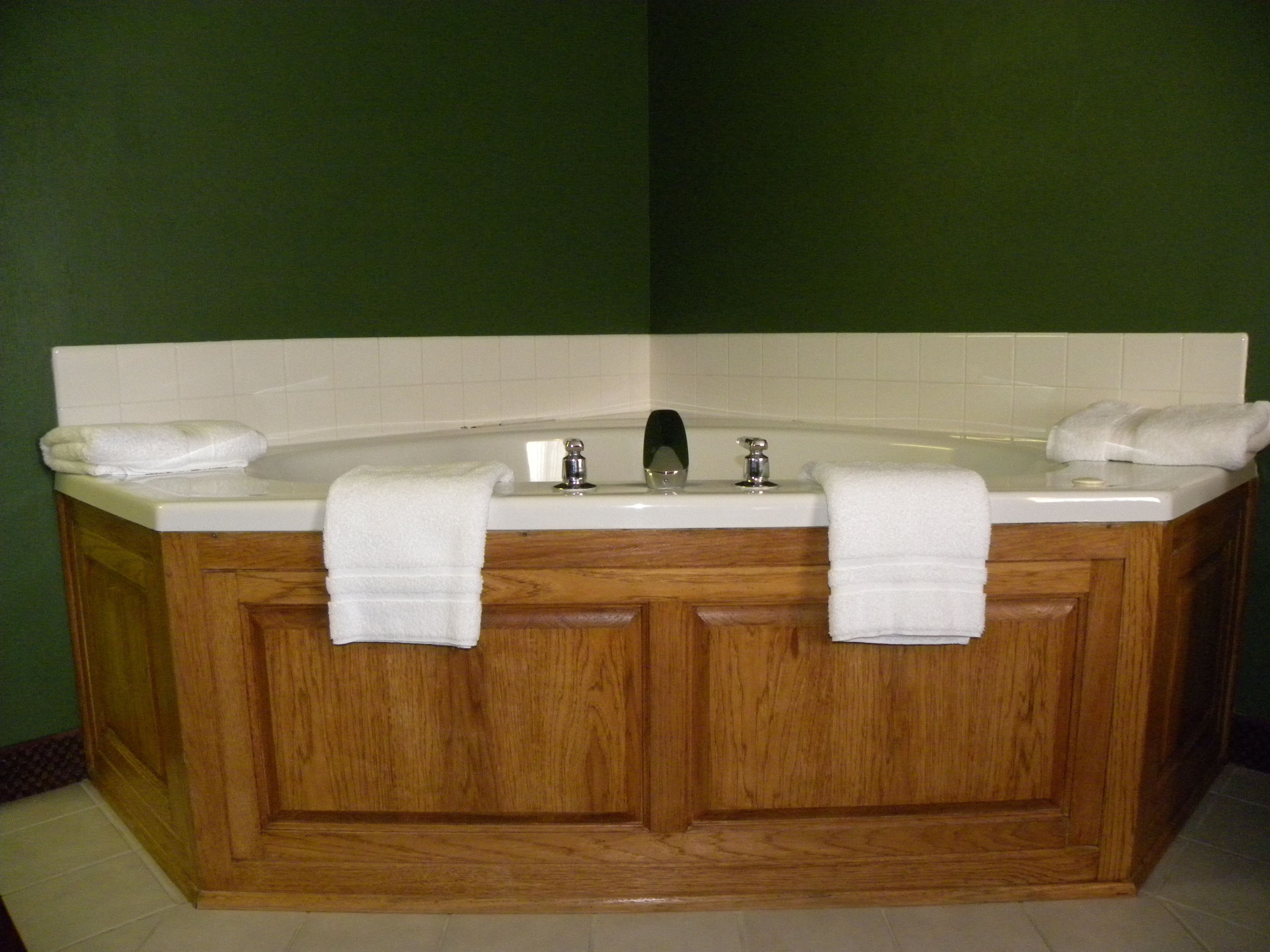 suite, 1 king bed, jetted tub | desk, laptop workspace, blackout curtains, iron/ironing board