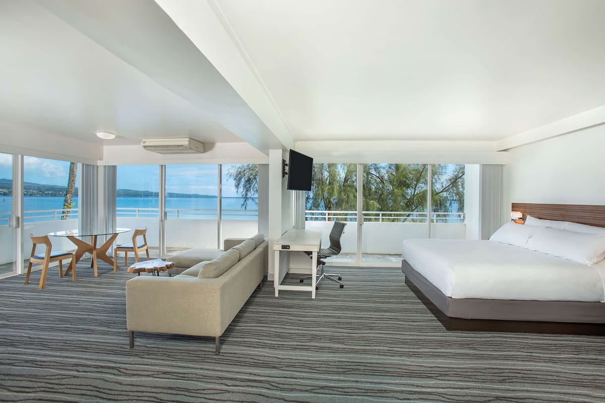 junior suite, 1 king bed, non smoking, oceanfront | living area | 48-inch lcd tv with cable channels, tv