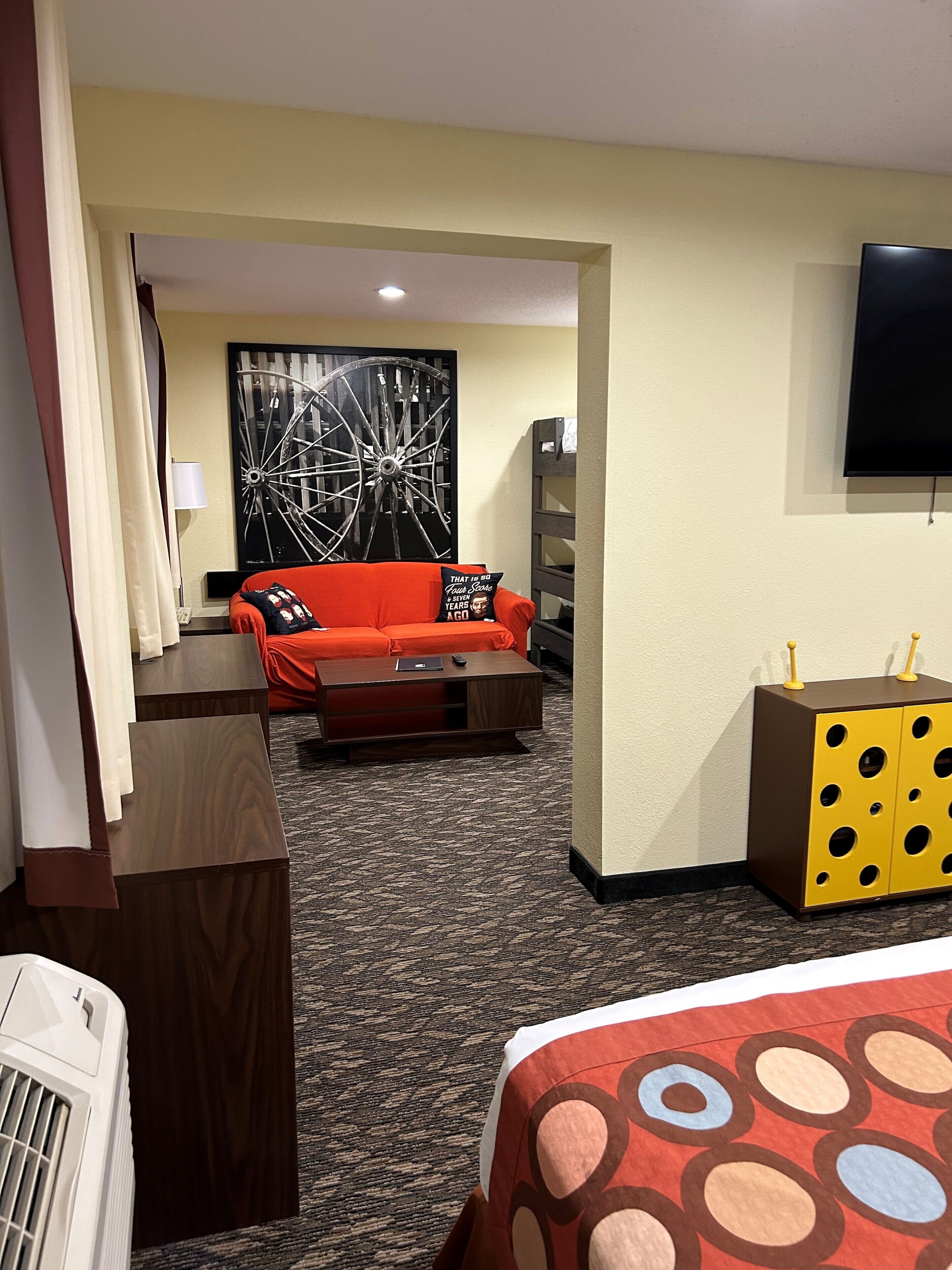 family suite, 1 king bed, 1 bunk bed, non smoking | in-room safe, laptop workspace, iron/ironing board