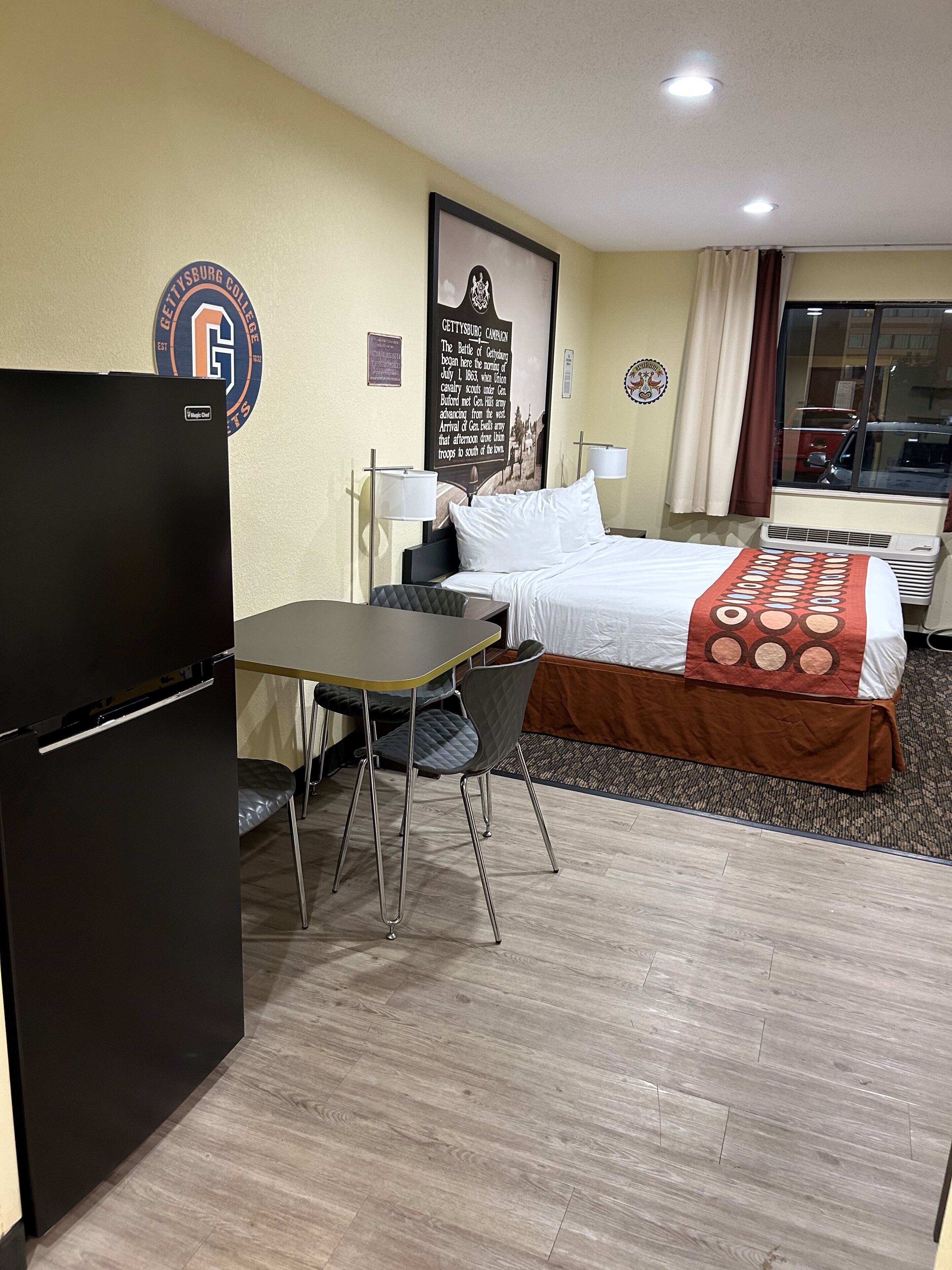 family suite, 1 king bed, 1 bunk bed, non smoking | in-room safe, laptop workspace, iron/ironing board