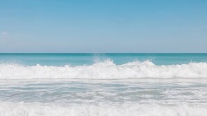 A beach with waves crashing onto the shore. - The Lucie (Jensen Beach)