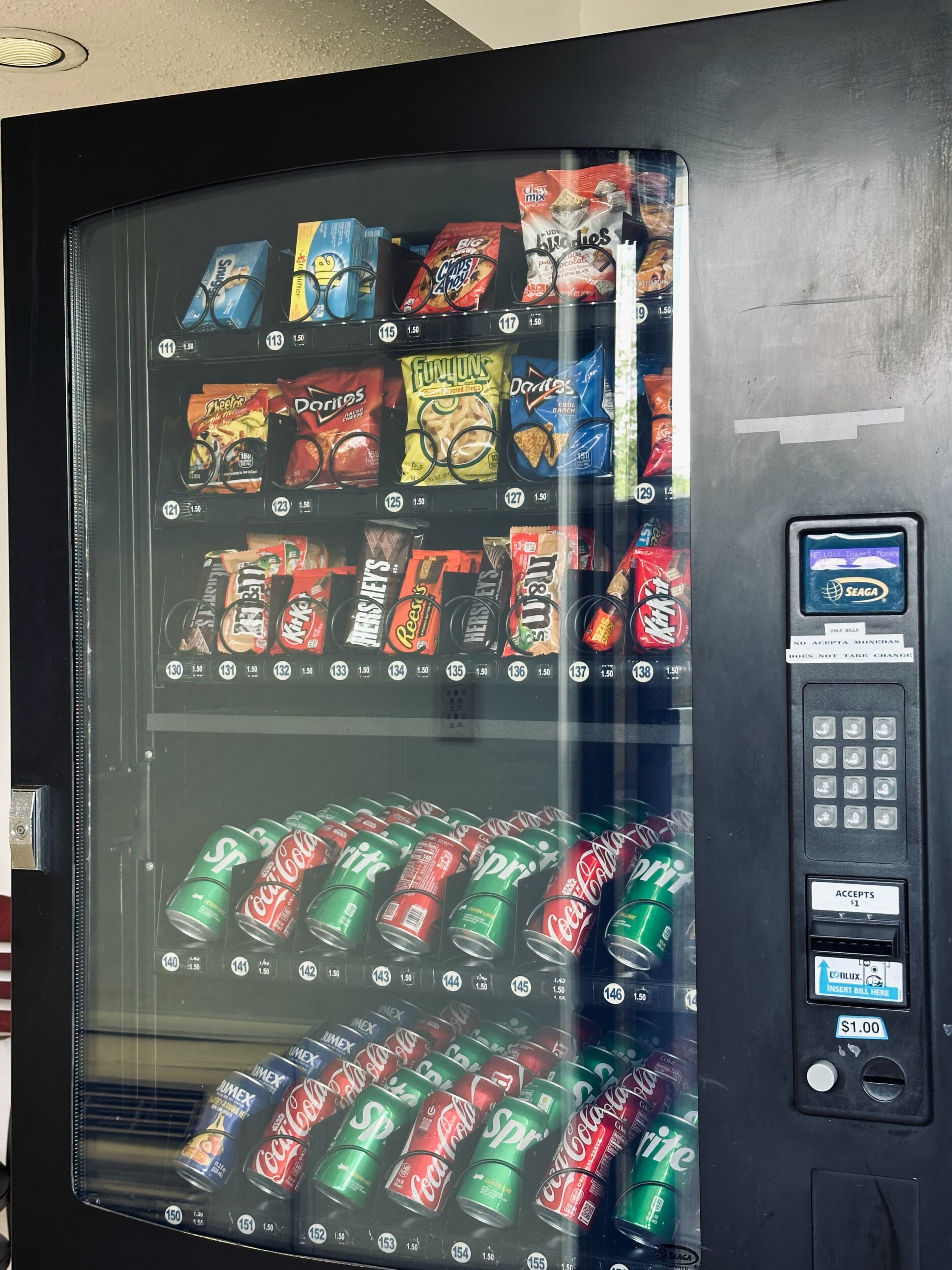 A vending machine with snacks and drinks.