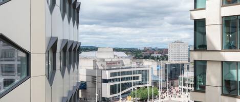 A modern building with a glass facade and a sign reading "Symphony Hall".