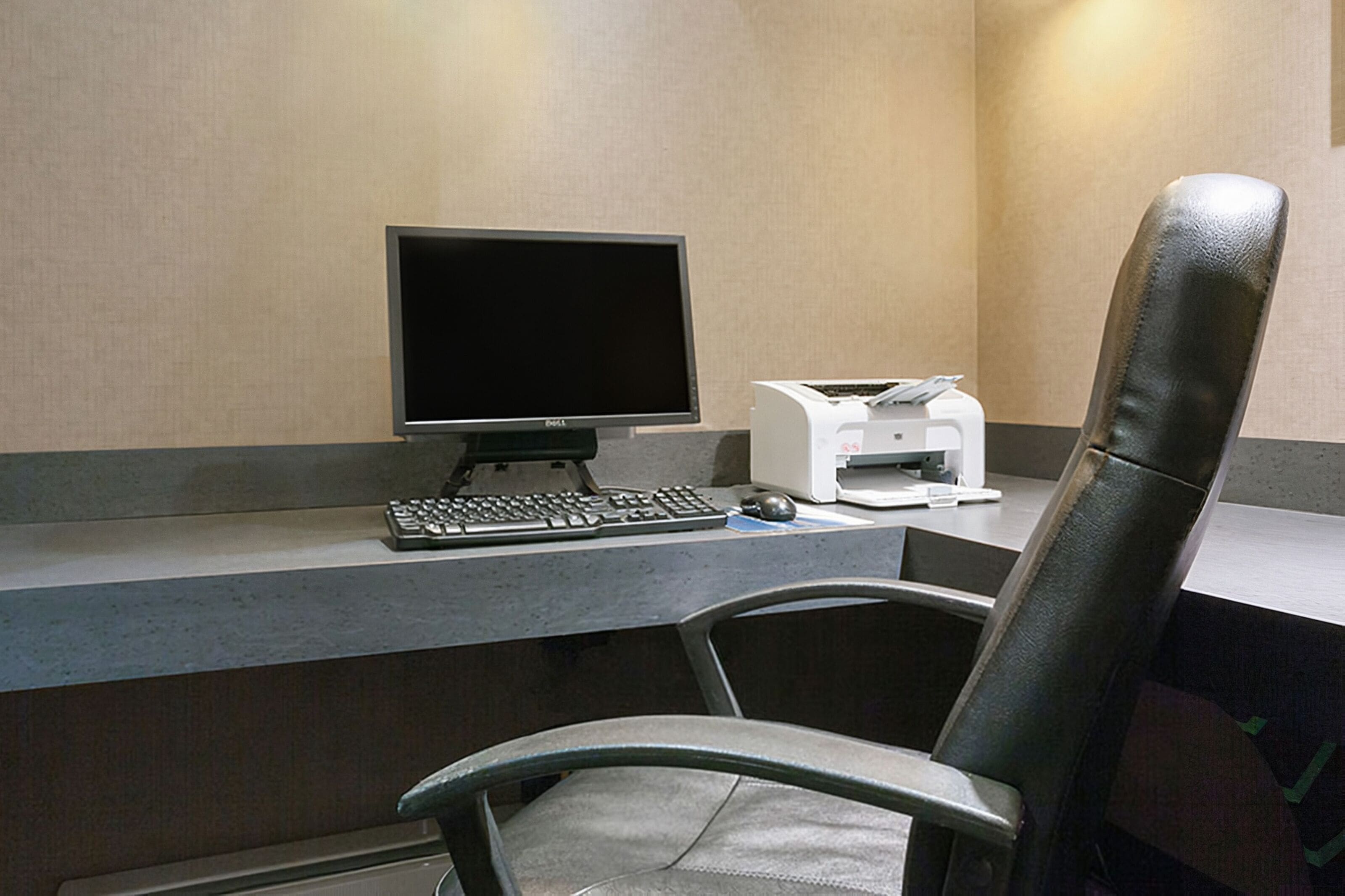 A desk with a computer, keyboard, mouse, and printer.