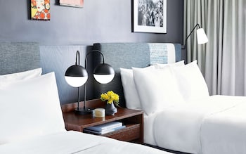 Hotel amenities such as safe, desk and work area at Hotel Kabuki, part of JdV by Hyatt