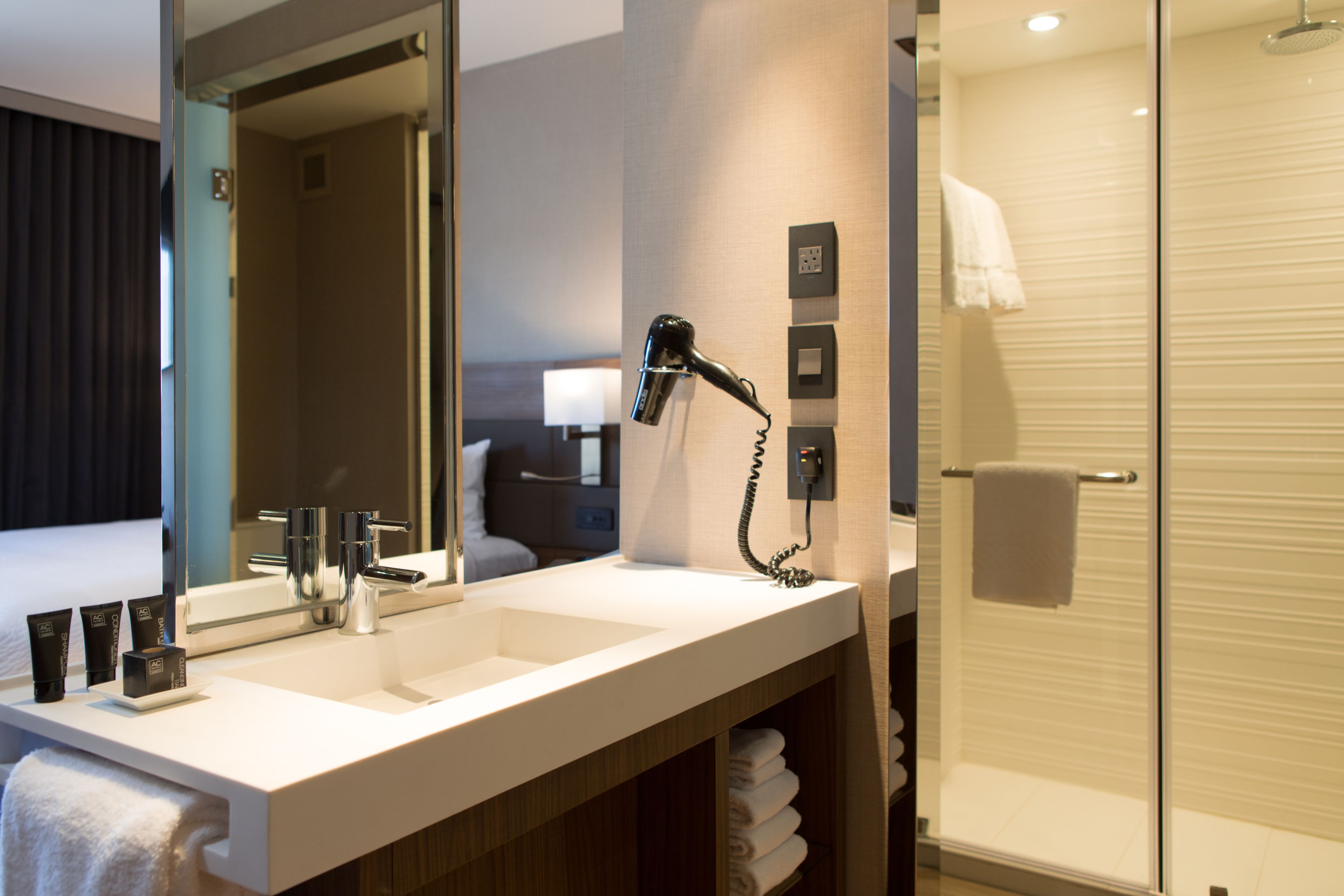 rainfall showerhead, designer toiletries, hair dryer, towels