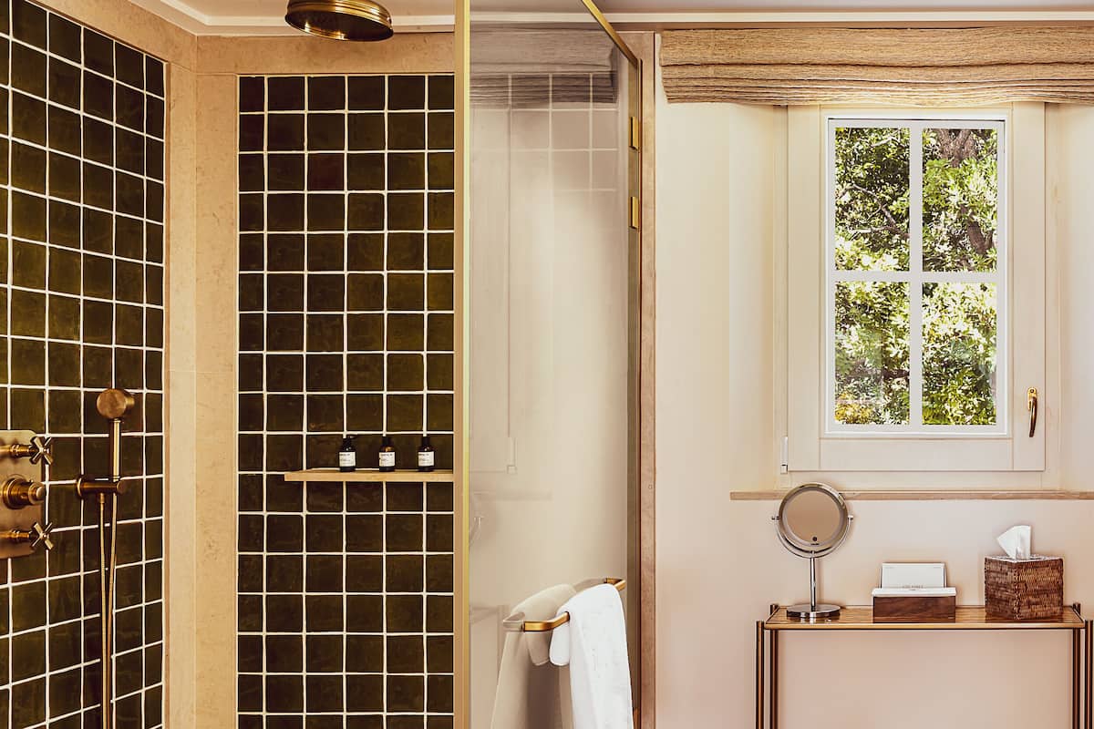 deluxe junior suite double or twin | bathroom | eco-friendly toiletries, hair dryer, bathrobes, slippers