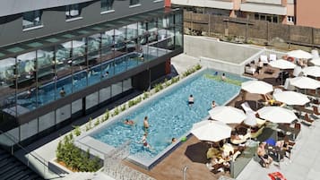 Seasonal outdoor pool, open 8:00 AM to 8:00 PM, pool umbrellas