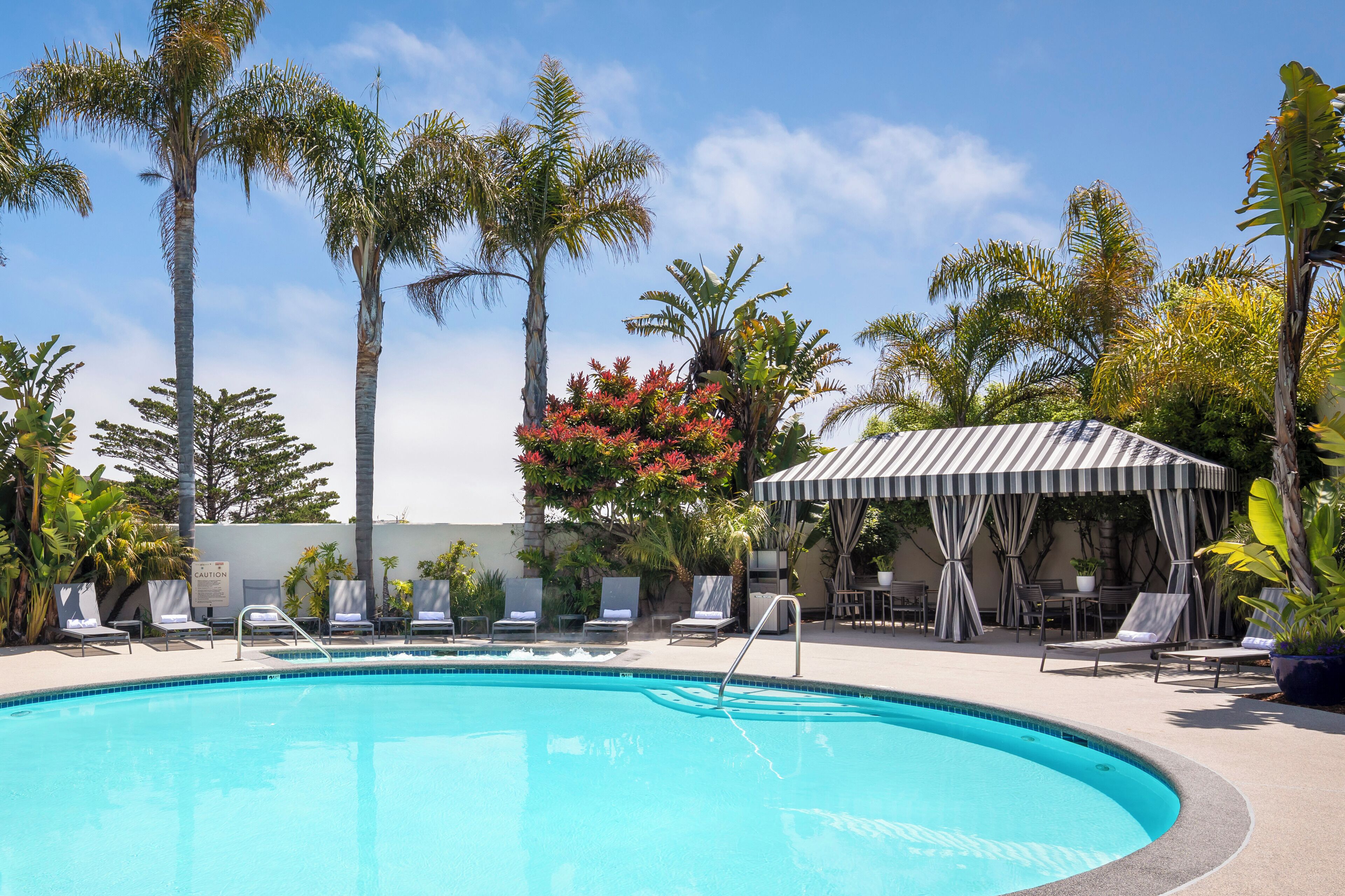 Outdoor pool, open 7:00 AM to 10:00 PM, pool loungers