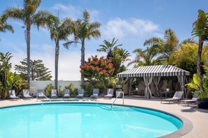 Outdoor pool, open 7:00 AM to 10:00 PM, pool loungers