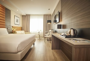 Premium bedding, down comforters, minibar, in-room safe