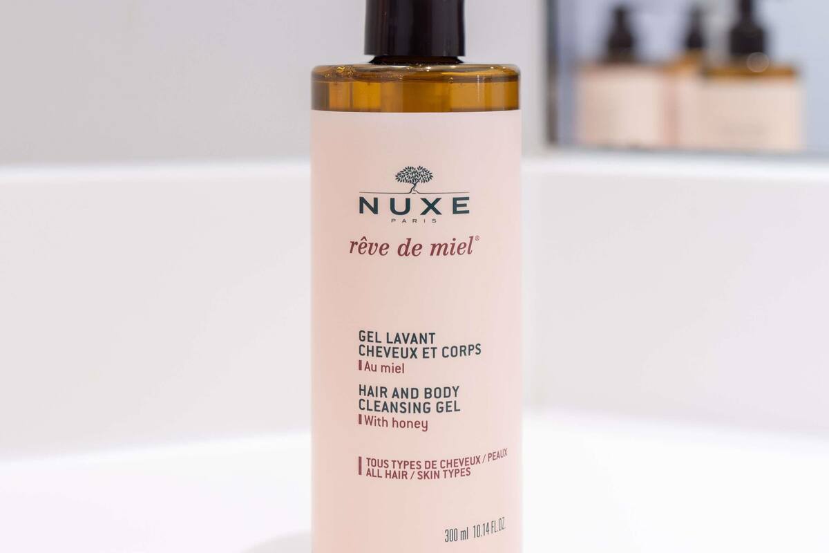 A bottle of NUXE Paris hair and body cleansing gel.