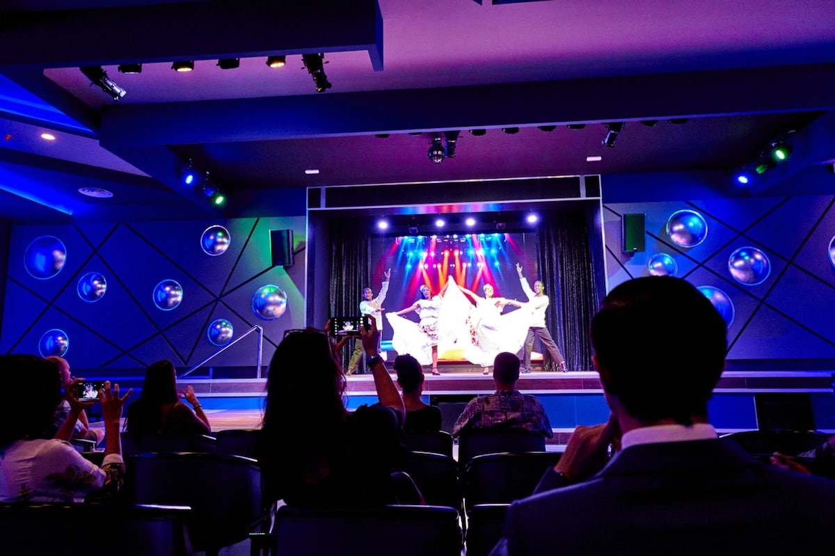 Enjoy live performances and presentations in this versatile event space with a stage and seating for guests.