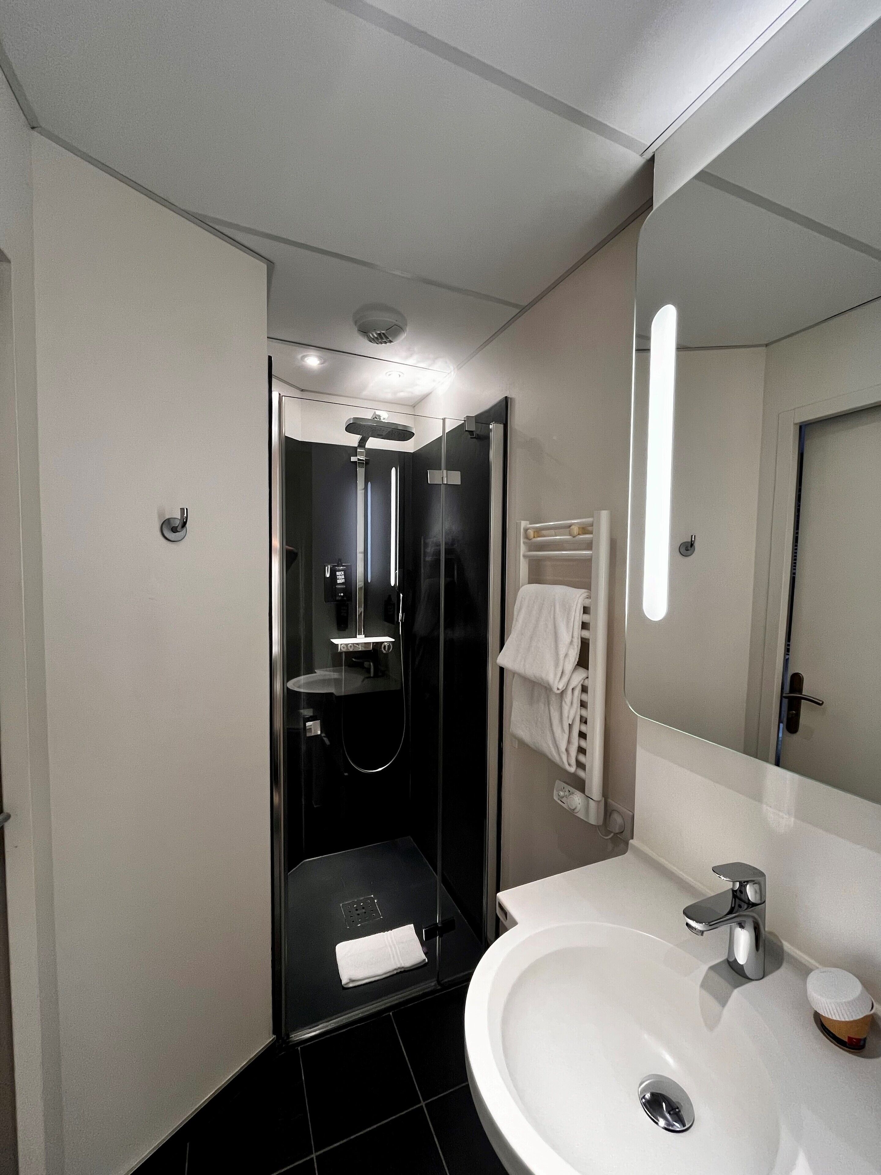 Shower, eco-friendly toiletries, hair dryer, towels