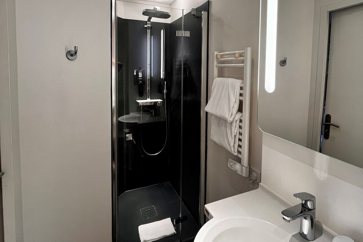 Shower, eco-friendly toiletries, hair dryer, towels