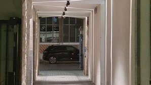 A narrow, brick-paved corridor with a car parked at the end. - ibis Besancon Centre Ville (Besancon)