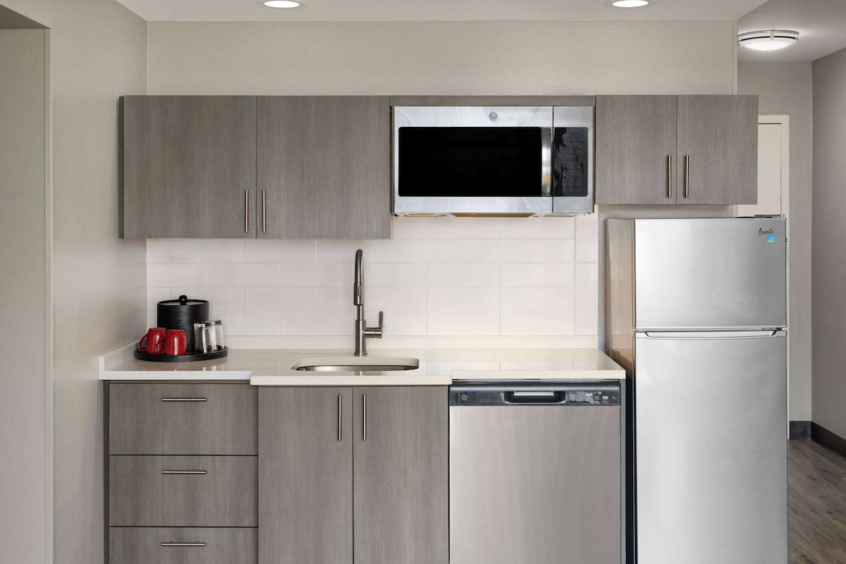 superior room, multiple beds, non smoking (kitchenette) | desk, blackout curtains, iron/ironing board, cots/infant beds