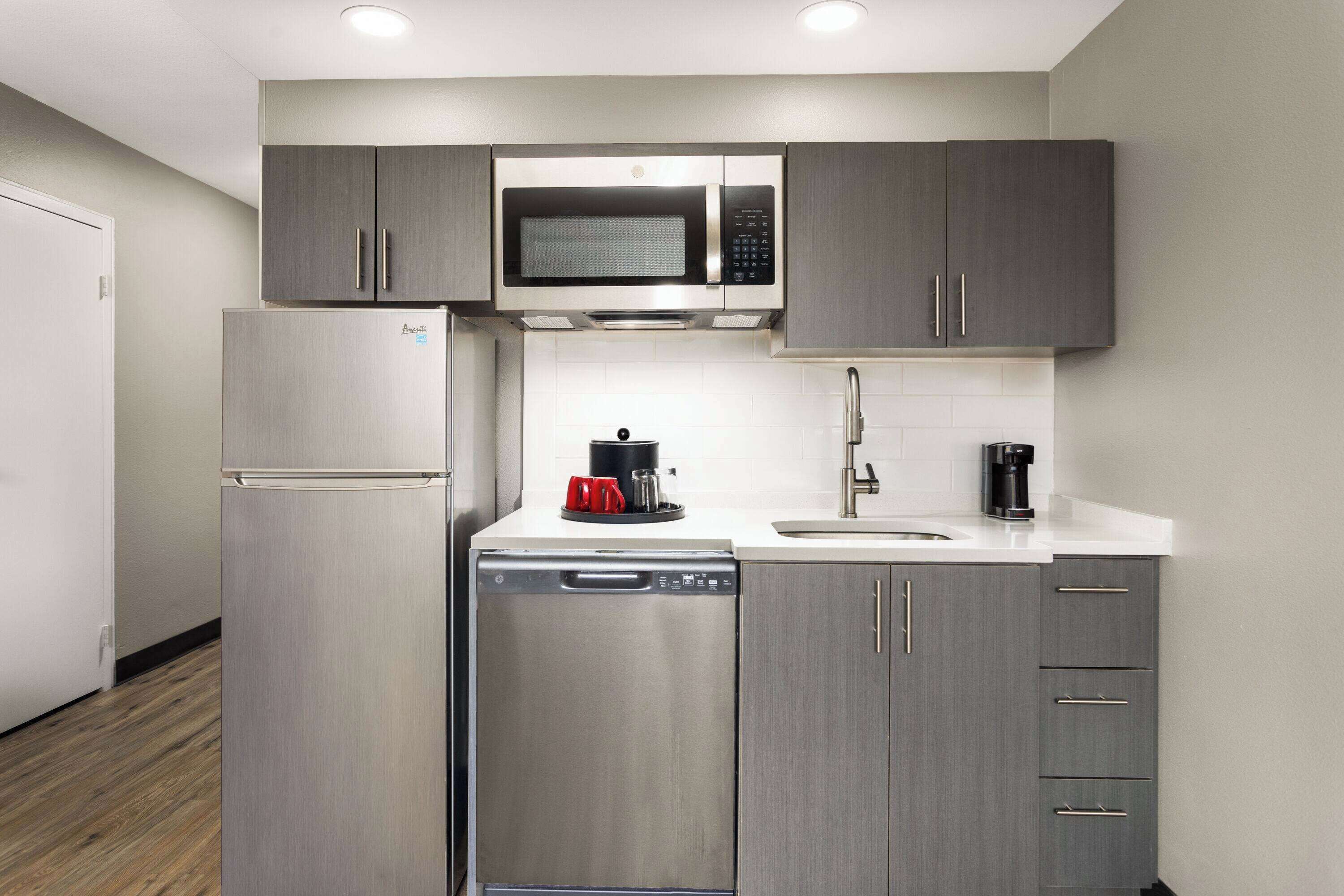 room, 1 king bed, non smoking (kitchenette) | desk, blackout curtains, iron/ironing board, cots/infant beds