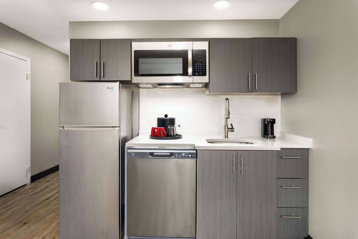 room, 1 king bed, non smoking (kitchenette) | desk, blackout curtains, iron/ironing board, cots/infant beds