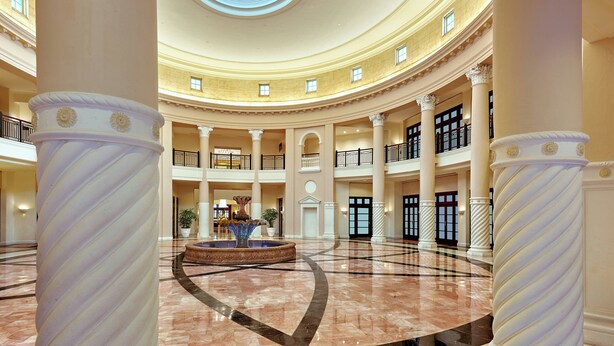 A spacious atrium with a central fountain, multiple balconies, and classical columns. - Hotel Colonnade Coral Gables, Autograph Collection (Coral Gables)