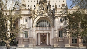 A grand building with a central arched entrance, columns, and a dome. - Hotel Colonnade Coral Gables, Autograph Collection (Coral Gables)