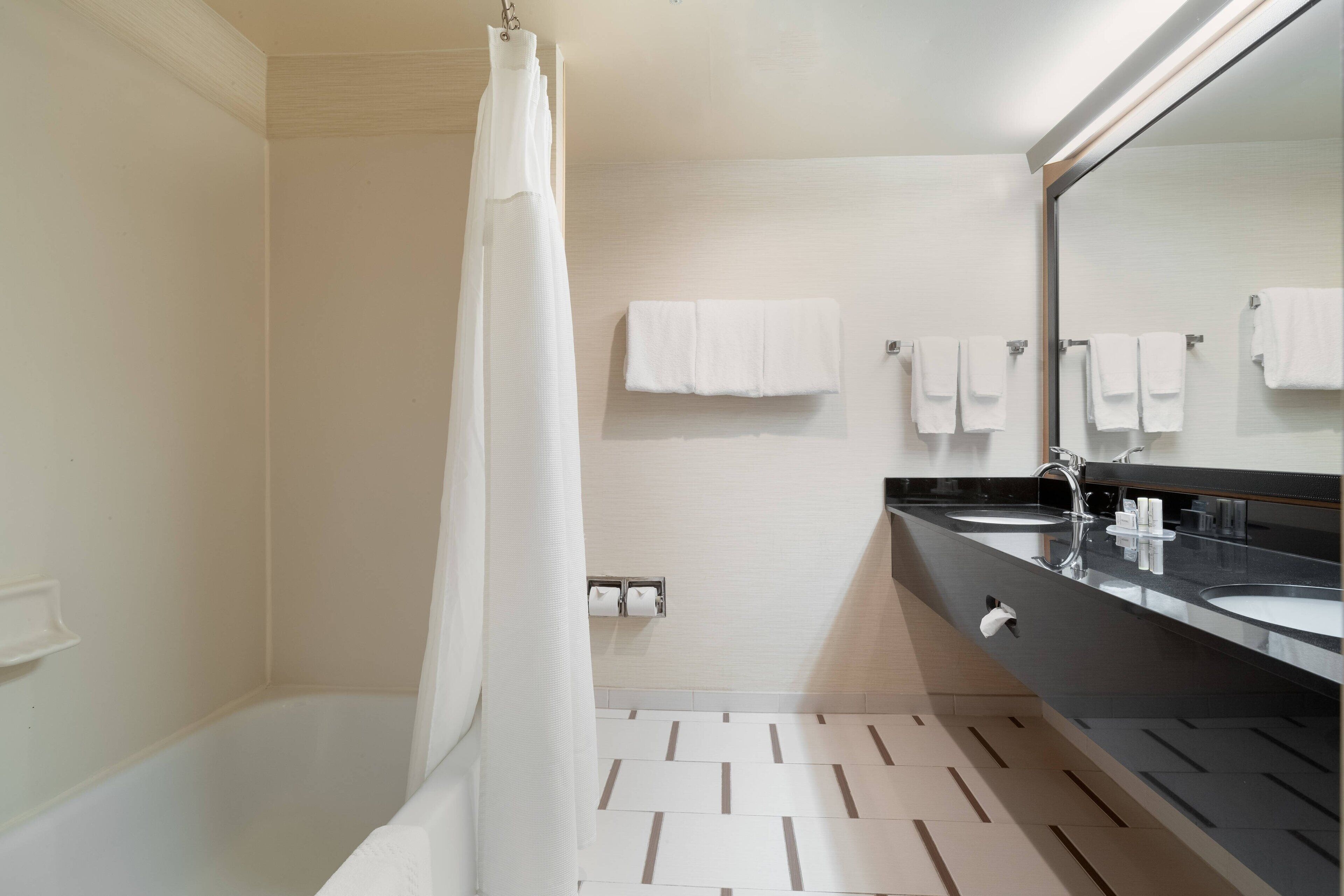 combined shower/bathtub, eco-friendly toiletries, hair dryer, towels