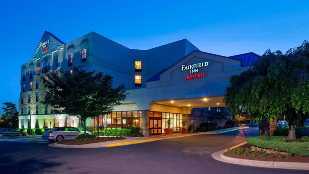 A multi-story Fairfield Inn Marriott hotel with a modern design, large windows, and a well-lit entrance. - Fairfield Inn By Marriott Laurel (Laurel)