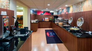 A kitchen area with a coffee machine, a waffle maker, and a food display. - Fairfield Inn By Marriott Laurel (Laurel)