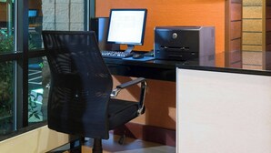 An office space with a computer, a printer, and a chair. - Fairfield Inn By Marriott Laurel (Laurel)