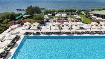 Indoor pool, seasonal outdoor pool, pool umbrellas, pool loungers