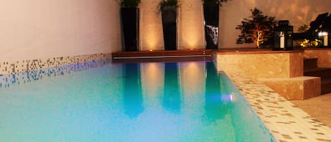 Seasonal outdoor pool, pool loungers