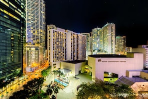 Overlooking the vibrant city, the Miami Convention Center stands tall amidst a backdrop of palm trees and sleek architecture.