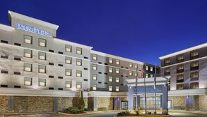 A hotel with a modern design, featuring a prominent 'DoubleTree by Hilton' sign, a parking lot, and a well-maintained exterior. - DoubleTree by Hilton Salisbury (Salisbury)