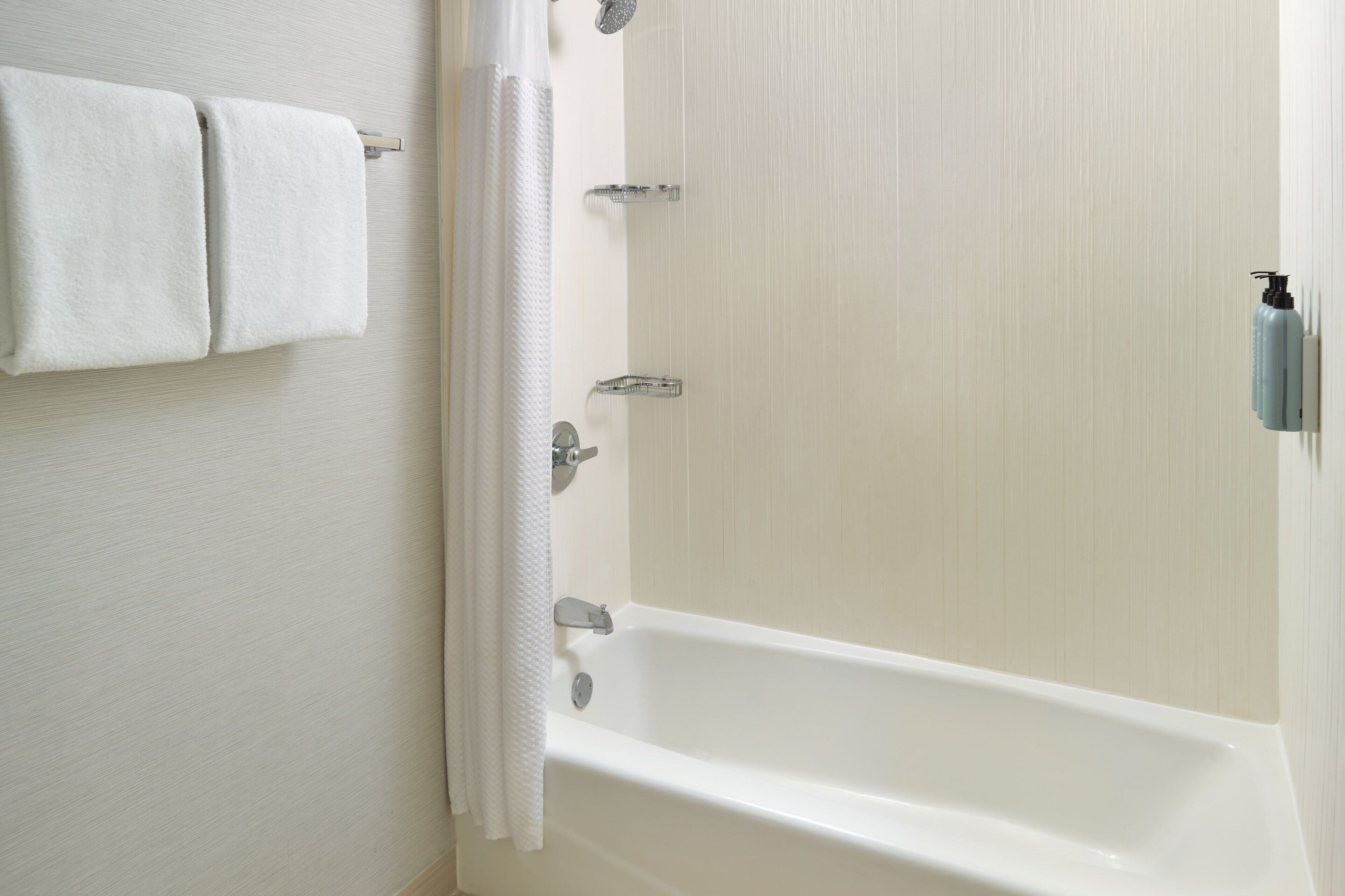 room, 2 queen beds | bathroom | combined shower/bathtub, eco-friendly toiletries, hair dryer, towels