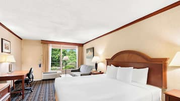 Desk, laptop workspace, blackout drapes, iron/ironing board