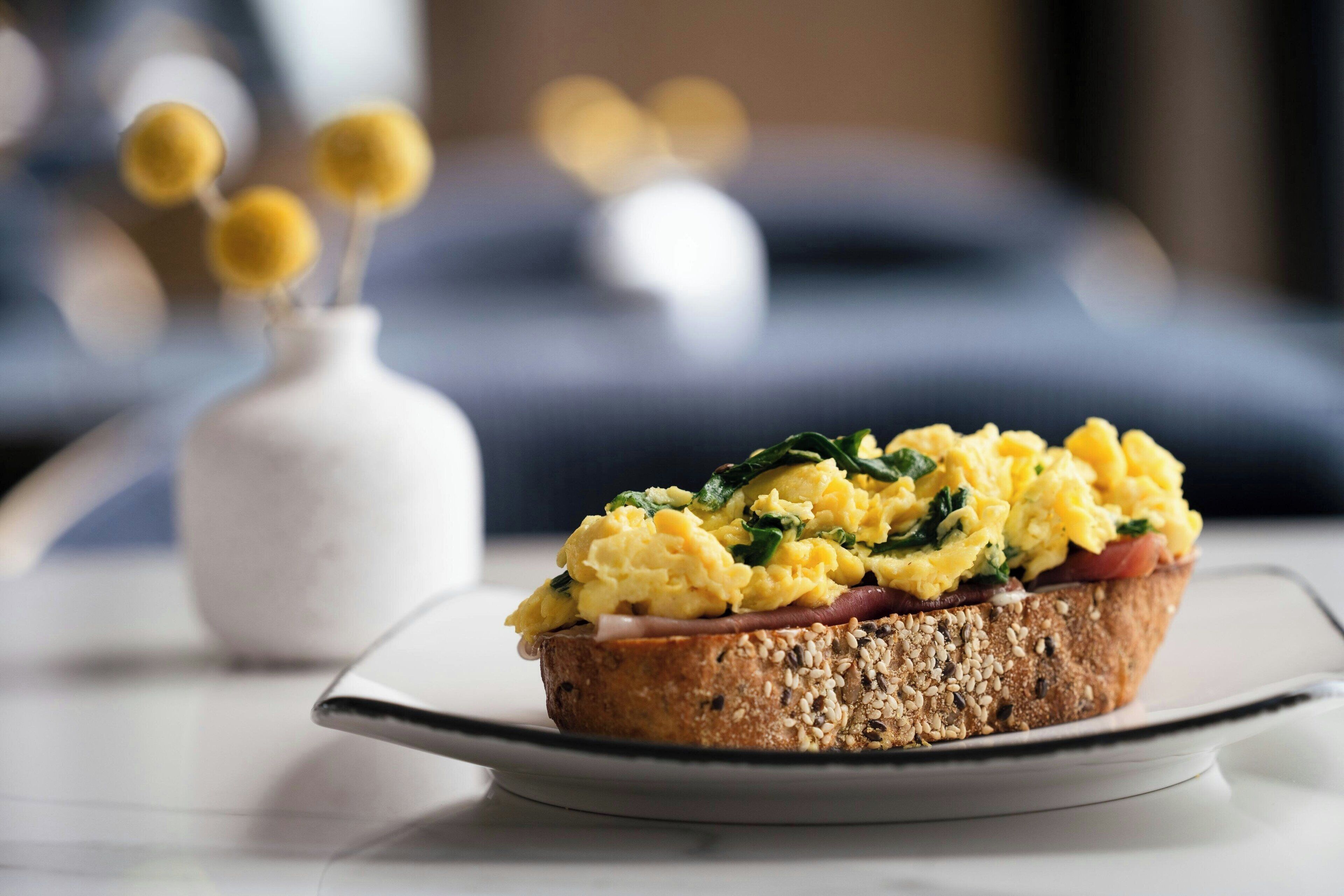 A breakfast dish on a plate with a blurred background.