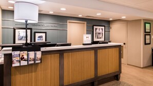 A reception desk with a sign reading "Welcome to West Covina." - Hampton Inn Los AngelesWest Covina (West Covina)
