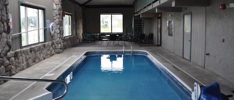 Indoor pool, open 9:00 AM to 11:00 PM, pool loungers