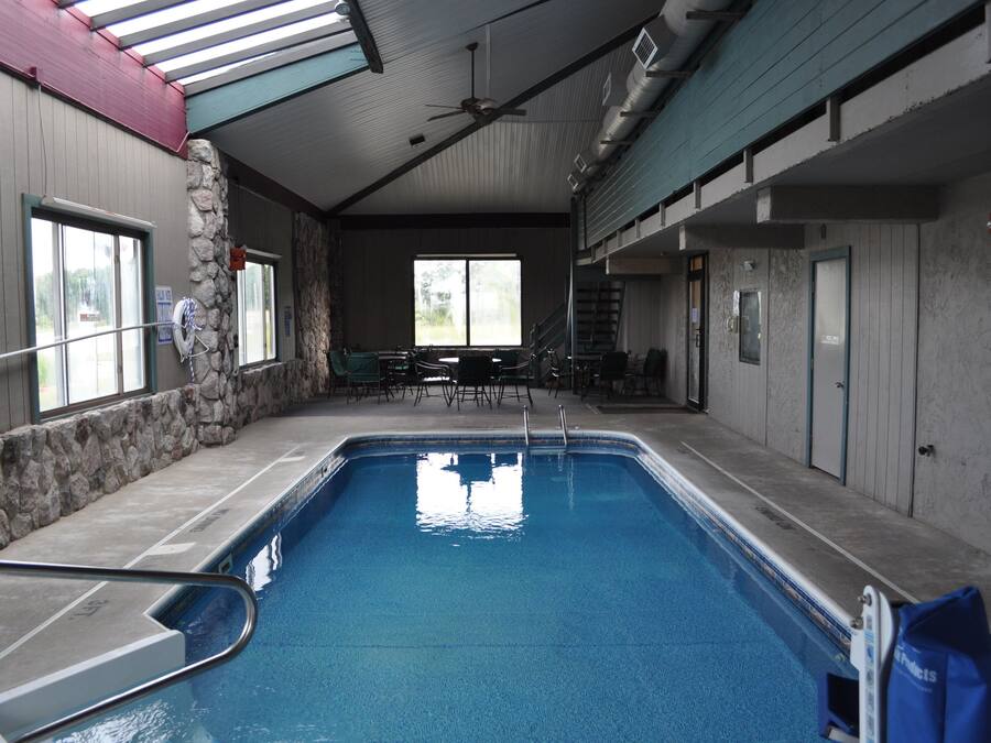 Indoor pool, open 9:00 AM to 11:00 PM, pool loungers