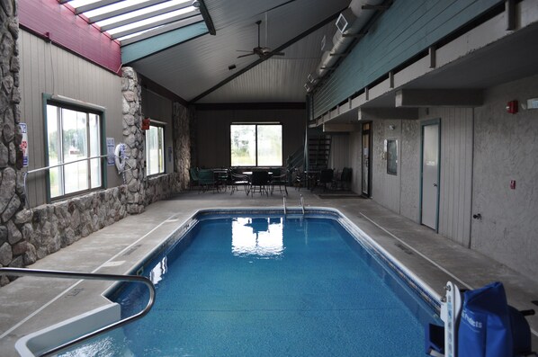 Indoor pool, open 9:00 AM to 11:00 PM, pool loungers