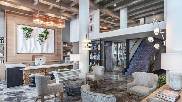 A spacious lobby with a reception desk, seating area, and a staircase leading to an upper level. - Hotel Triton Union Square San Francisco (San Francisco)