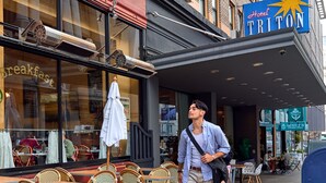 A hotel exterior with outdoor seating, a visible restaurant sign, and a clear view of the street. - Hotel Triton Union Square San Francisco (San Francisco)