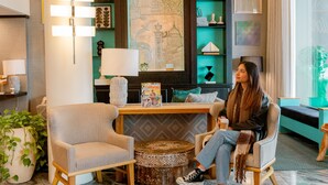 A modern interior with a central seating area, a large chandelier, and a wall with framed artwork. - Hotel Triton Union Square San Francisco (San Francisco)