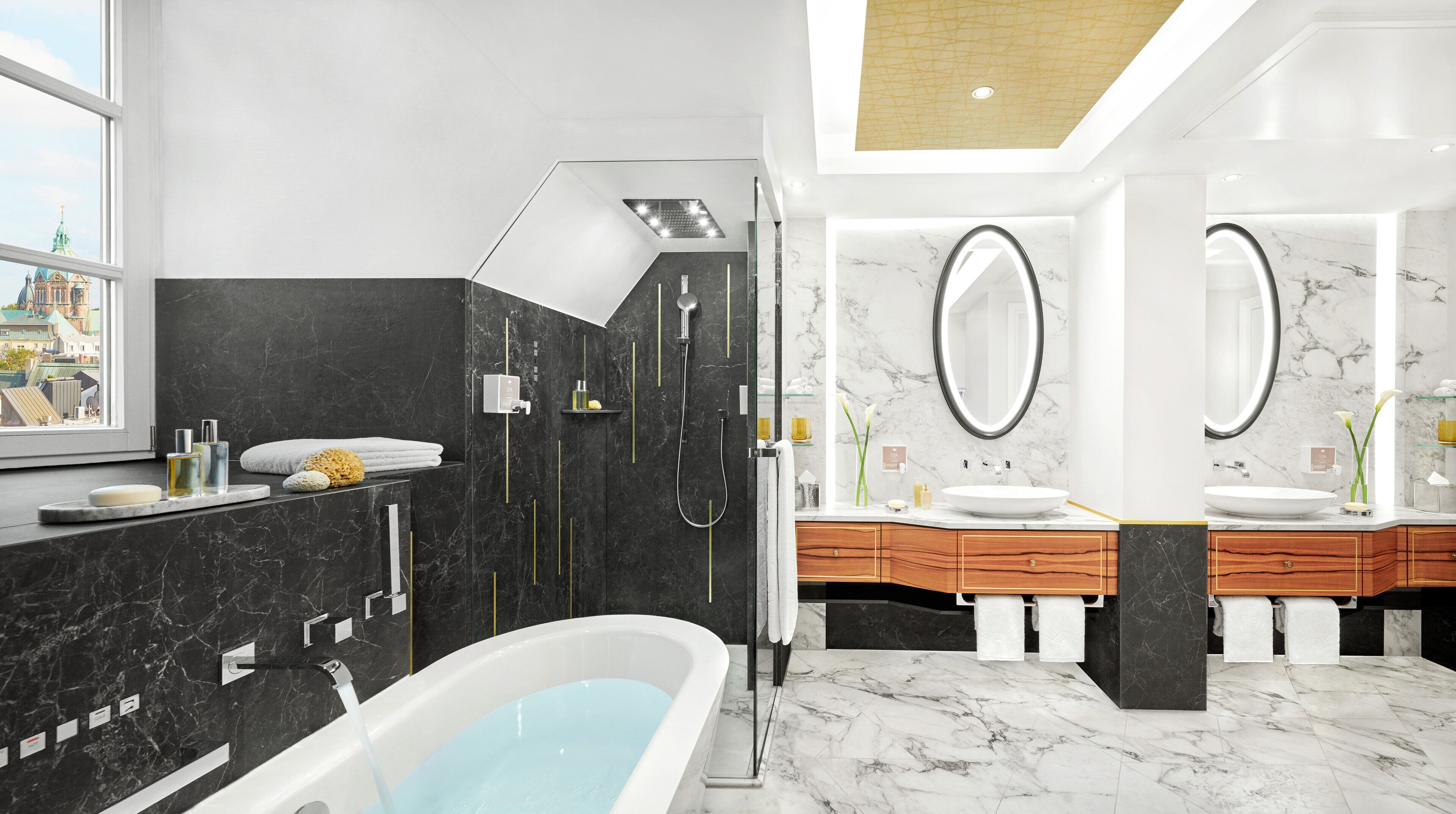 Ein modernes Badezimmer mit Badewanne, Dusche und einem Waschtisch mit zwei Becken.
